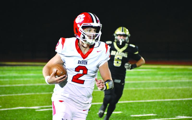 Wesley Branch/The Clayton Tribune. Rabun County senior quarterback Ty Truelove looks downfield on a run versus Pepperell in the state quarterfinals on Nov. 28. Truelove was named first-team All-Region for the third consecutive season this season. Truelove was named the first team All-Region quarterback.