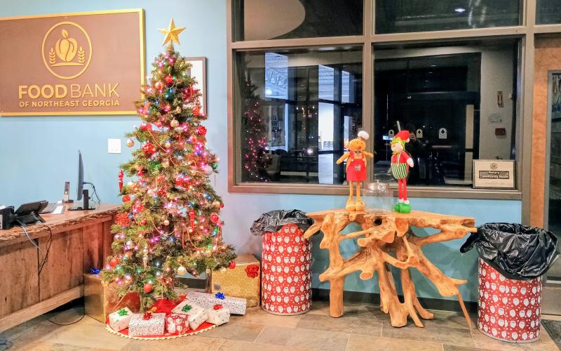 Megan Horn/The Clayton Tribune. The Food Bank of Northeast Georgia was decorated with colorful Christmas decorations as volunteers passed out gifts to members of the community on Tuesday.