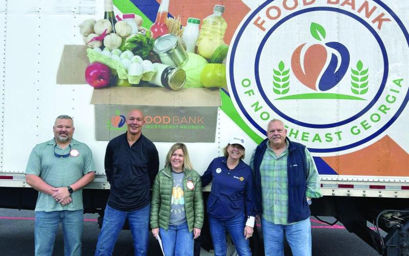 Submitted photo. The Rotary Impact Club of Clayton recently organized a food and fund drive for the Food Bank of Northeast Georgia where 4,836 pounds of food and $1,724 in donations were raised. Pictured are Kyle Shook; James Brim, Food Bank of Northeast Georgia Mountain Branch director; Sonya Shook; Amy Hulett; and Jon Tuck, president of the Rotary Impact Club of Clayton.