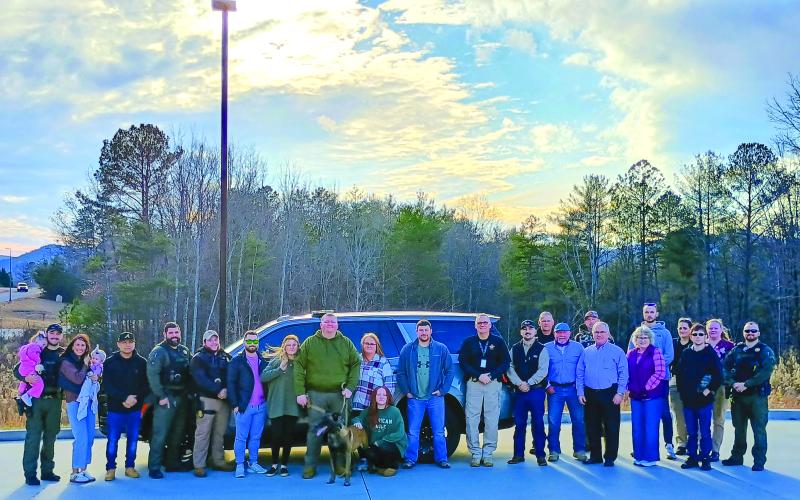 Megan Horn/The Clayton Tribune.  K-9 Handler Michael Shedd and those who worked closely with K-9 “Coss” attended a retirement reception for the working canine held at the Rabun County Sheriff’s Office Dec. 10. That day, K-9 Coss officially retired from active service.