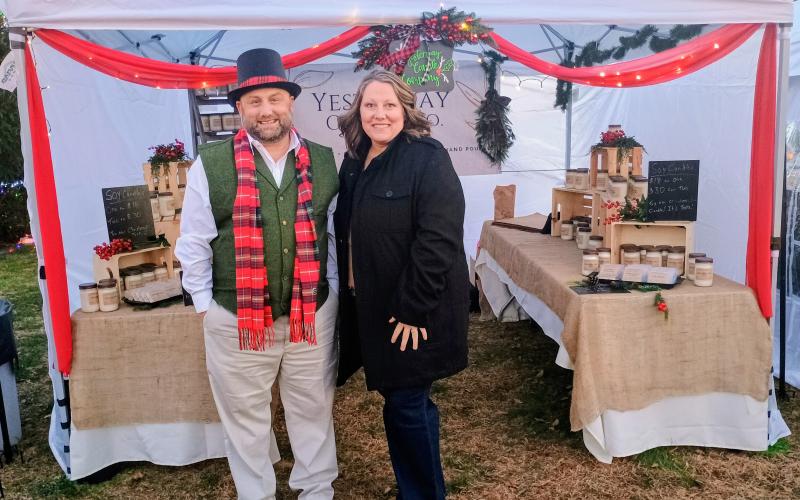 Megan Horn/The Clayton Tribune. Jared Winters and Janelle Harden with Yesterway Candle Company sell their candles during the Saturday, Dec. 13 “Dickens in Dillard” Christmas festival.