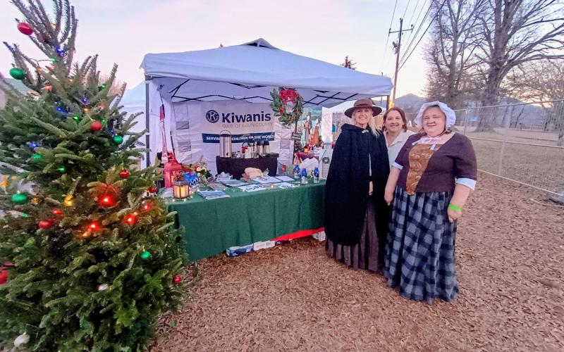Megan Horn/The Clayton Tribune. The Kiwanis Club of Rabun County had a hospitality table set up at last Saturday’s “Dickens in Dillard” Christmas festival.