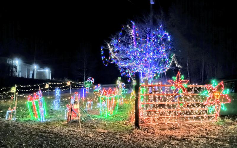 Megan Horn/The Clayton Tribune. The Christmas Village of Lights is on display in Tiger for the holidays. The display offers family-friendly fun and features thousands of lights, characters and decorations, synced to Christmas music for a sing-along. Those passing by can even tune in to 98.7 to enjoy the music.