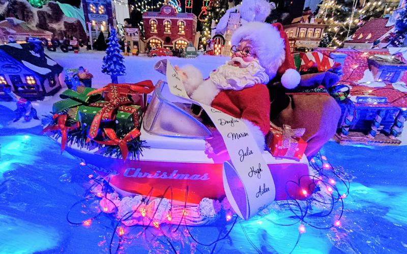 Megan Horn/The Clayton Tribune. The Christmas Village in Tiger features many funny and unique characters, including Santa riding in a boat.