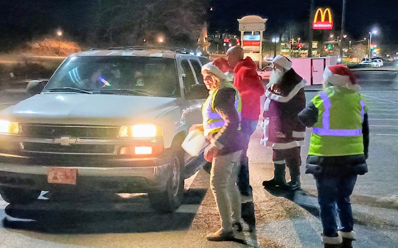 Megan Horn/The Clayton Tribune. Volunteers at the Food Bank of Northeast Georgia helped spread Christmas cheer on Tuesday, Dec. 16, as they passed out gifts to kids of all ages during a toy drive the week before Christmas.
