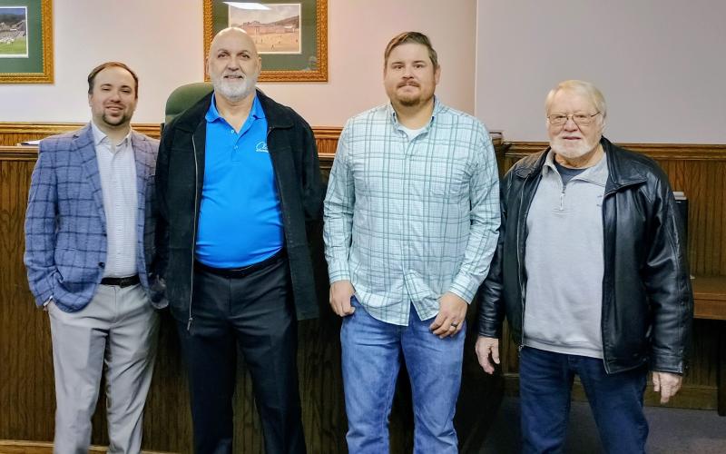 Megan Horn/The Clayton Tribune. The Clayton City Council will see new faces in 2026 after newly elected Channing Watts and Colt Woodall both took the Oath of Office to be official council members. Pictured are Woodall, Post 2 council member, left; Mayor Roy Quilliams; Watts, Post 1 council member; and incumbent Council Member Tony Allen.