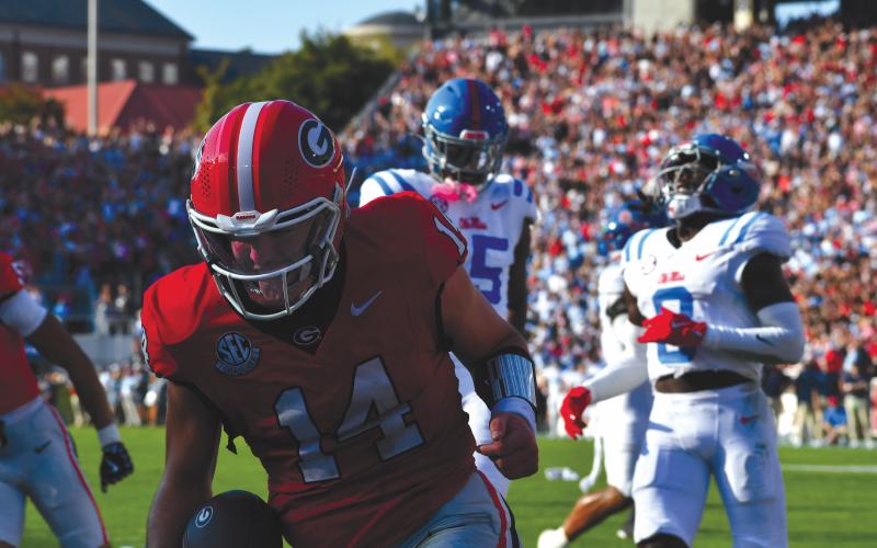 Wesley Branch/The Clayton Tribune. Gunner Stockton celebrates in the end zone after a rushing touchdown in Georgia’s 43-35 win over Ole Miss on Oct. 18. Stockton finished top-10 in Heisman voting as the starting quarterback for the Bulldogs.
