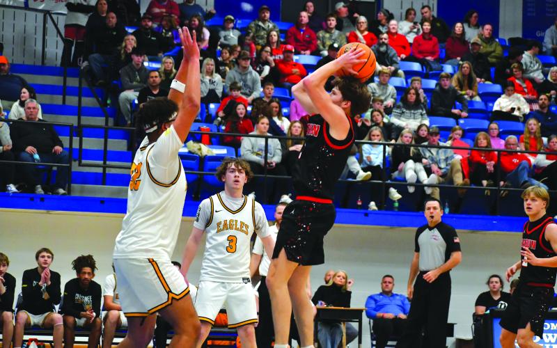 Wesley Branch/The Clayton Tribune. Rabun County senior Huey Blalock shoots over a Chesnee defender in Rabun County’s 64-59 win on Dec. 30 in the Battle of the States Tournament championship game. Blalock finished the game with 10 points and 14 assists, marking his ninth double-double of the season.
