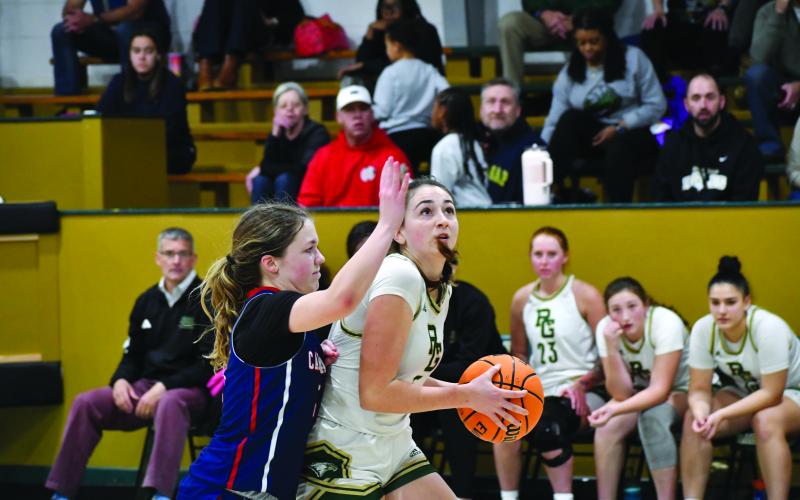 Wesley Branch/The Clayton Tribune. Rabun Gap senior Lydia McNabb fights off a Carolina Day defender in Rabun Gap’s 59-27 win over Carolina Day on Jan. 8. The Lady Eagles had over three weeks in between games due to the holiday break.