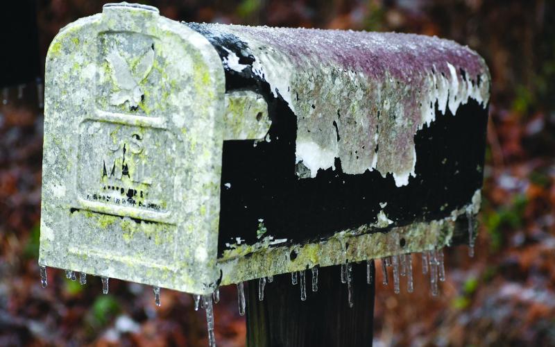 Enoch Autry/The Clayton Tribune. While the ice does cause a lot of problems, it also adds a natural element to everyday outdoor items like this aged mail box.