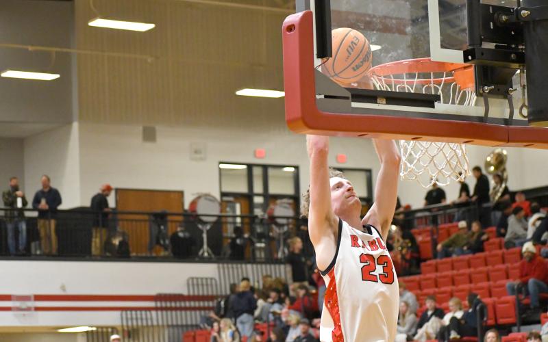 Wesley Branch/The Clayton Tribune. Rabun County senior Hayes Free soars for a dunk in Rabun County’s win over Athens Academy. Free made the go-ahead layup with 1:36 remaining and knocked down two key free throws in the win.