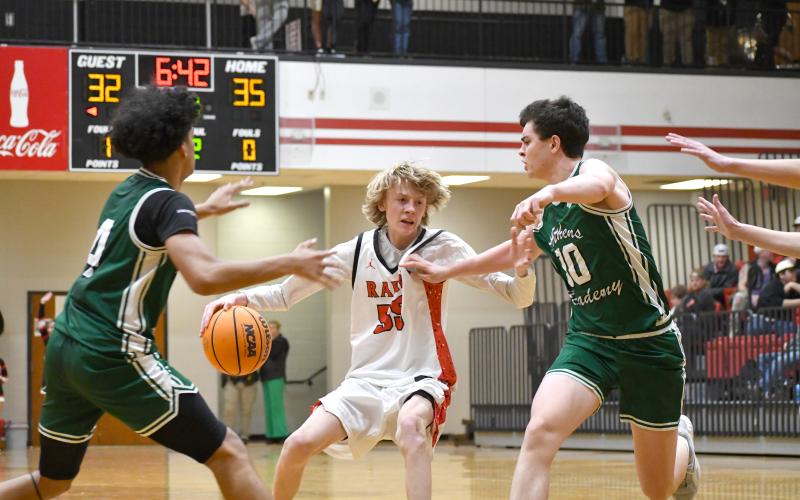 Wesley Branch/The Clayton Tribune. Rabun County freshman Trace Adcock fights through contact while driving to the basket in Rabun County’s 43-40 win over Athens Academy on Jan. 13. Adcock is second on the Wildcats in scoring and is shooting a team-high 53 percent from the 3-point line this season.