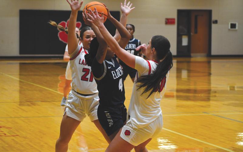 Wesley Branch/The Clayton Tribune. Rabun County seniors Madison Houck (right) and Loren Mazarky (left) double-team an Elbert County ballhandler in Rabun County’s 54-49 loss to Elbert County on Jan. 20. The Lady Wildcats will face East Hall on the road on Jan. 24, while Commerce visits on Jan. 27.