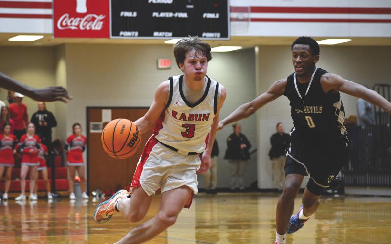 Wesley Branch/The Clayton Tribune. Rabun County senior Huey Blalock drives to the basket in Rabun County’s 71-48 win against Elbert County on Jan. 20. Blalock posted a triple-double in the win. Navy-commit Blalock finished the night with 10 points, 15 assists, 10 rebounds and three steals.
