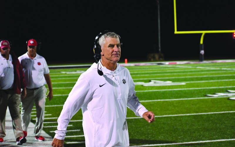 Wesley Branch/The Clayton Tribune. Rabun County defensive coordinator Bill Stewart eyes the camera during Rabun County’s season-opening 42-6 win over White County on Aug. 15, 2025. Stewart was reportedly in consideration for the Rome head coaching job, which was expected to be voted upon on Jan. 20 at a Rome City Schools Board of Education meeting.