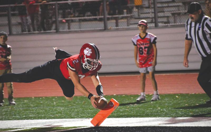 Wesley Branch/The Clayton Tribune. Rabun County senior quarterback Ty Truelove dives for the pylon for a touchdown in Rabun County’s 35-0 second round playoff win over Berrien on Nov. 21, 2025. Truelove scored three total touchdowns in the win for the Wildcats. Truelove, a three-year starter for the Wildcats, will play for Erskine College.
