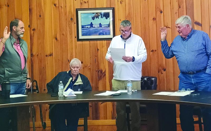 Megan Horn/The Clayton Tribune. Incumbent Post 3 Council Member Jeff Harris, left, and incumbent Post 5 Council Member Tremaine “Terry” Wilson, right, take the Oath of Office, administered by Mayor Claude Dillard on Jan. 13. The City of Dillard cancelled its municipal election for Nov. 4  due to Dillard, Harris and Wilson being the only ones to qualify for their respective seats. Pictured second from left is Council Member Jack Roberts.