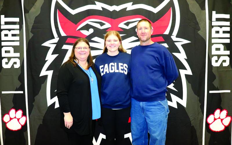 Photo courtesy of Von Watts. Rabun County senior Chloe Shirley poses with her parents, Maria and Josh on Jan. 23 at her signing day ceremony on Rabun County’s campus. Shirley signed to continue her athletic and academic careers at Georgia Southern University East Georgia. Shirley played first and third base for the Lady Cats.