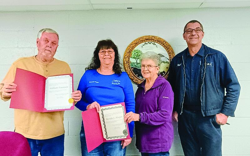 Megan Horn/The Clayton Tribune. The City of Mountain City council includes Bill Fountain, left; Brenda Hooper; Mayor Grace Watts; Michael Holt and Eric McCrackin (not pictured). Fountain and Hooper hold up official documents from Tammy Whitmire, director of elections, certifying their wins in the Nov. 4, 2025, General Election. Fountain was elected to the Post 3 Council Member seat while Hooper was re-elected to the Post 2 Council Member seat after running unopposed.
