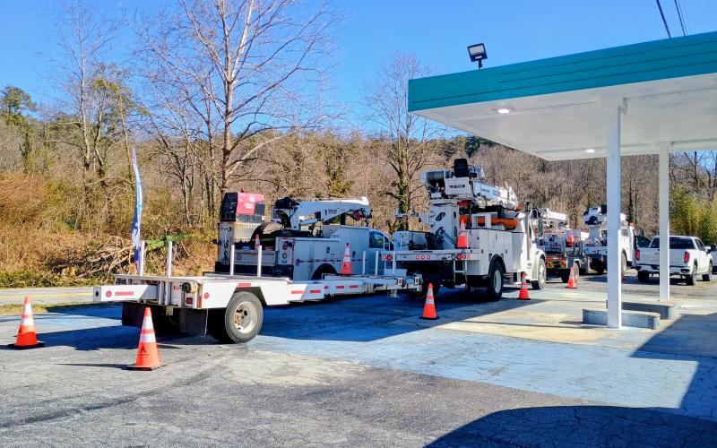 Megan Horn/The Clayton Tribune. Several utility vehicles and personnel were seen at the Crestview Store business on Highway 76 West, just outside of Clayton city limits, Tuesday morning. Personnel worked throughout Winter Storm Fern nonstop to help restore power throughout Rabun County.