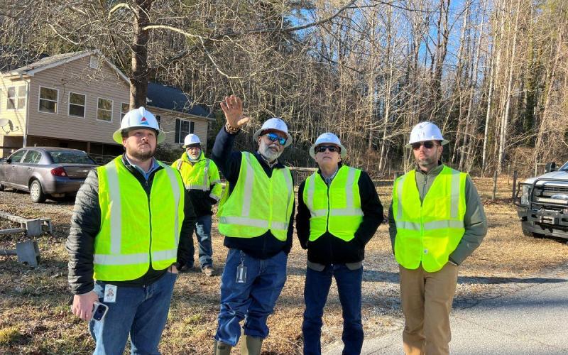 Photos courtesy Rep. Andrew Clyde’s Office. U.S. Rep. Andrew Clyde (second from right) gets a firsthand look at Georgia Power’s restoration efforts.