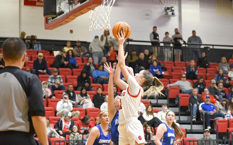 Wesley Branch/The Clayton Tribune. Rabun County senior Conley Spivey fights through the Armuchee defense for a layup in Rabun County’s 63-42 first-round playoff win over Armuchee on Feb. 24. Spivey finished the game with 10 points and 11 rebounds as she and the Lady Cats now will face No. 10 Model in the Sweet 16 later this week.