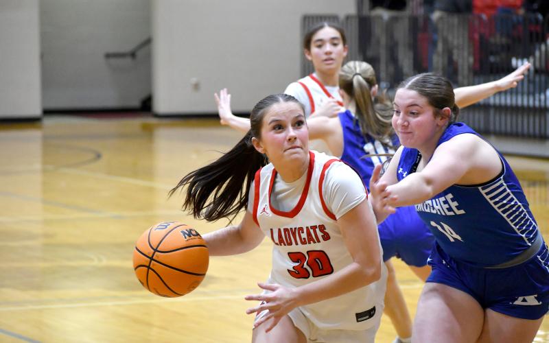 Wesley Branch/The Clayton Tribune. Rabun County senior Madison Houck drives to the basket in Rabun County’s 63-42 first round playoff win over Armuchee on Feb. 24. Houck finished the win with 12 points and 10 rebounds.