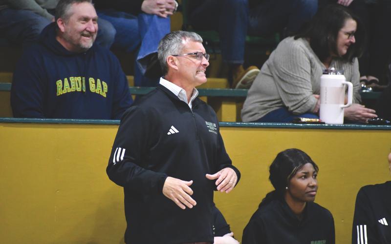 Wesley Branch/The Clayton Tribune.  Rabun Gap girls head basketball coach Dale Earnhardt directs his team from the sideline during the Lady Eagles’ 59-27 win over Carolina Day on Jan. 8. Rabun Gap defeated Carolina Day on Jan. 29 to earn Earnhardt’s 450th career win and currently sits at 12-9 on the season.