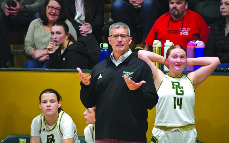 Wesley Branch/The Clayton Tribune. Rabun Gap-Nacoochee head girls basketball coach Dale Earnhardt (left) and Rabun Gap senior Alyssa Ashe (right) disagree with a call during Rabun Gap’s 59-27 win over Carolina Day on Jan. 8. Earnhardt has been leading Rabun Gap’s girls basketball program for 19 seasons.