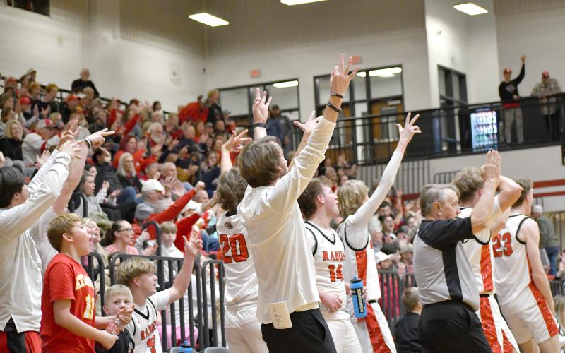 Wesley Branch/The Clayton Tribune. The Rabun County bench celebrates a 3-pointer late in its 80-47 first round playoff win over Chattooga on Feb. 24. The Wildcats will host each playoff game they play in until the state semifinals, which are at Fort Valley State University near Warner Robins, Ga.