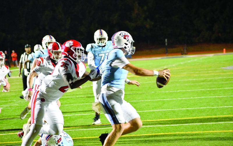 Wesley Branch/The Clayton Tribune. Rabun County senior defensive lineman TJ Hibler sacks Providence Christian Academy quarterback Riley Braiden in Rabun County’s 62-21 win over PCA on Sept. 26, 2026. Hibler announced his commitment to Cumberland University last week.