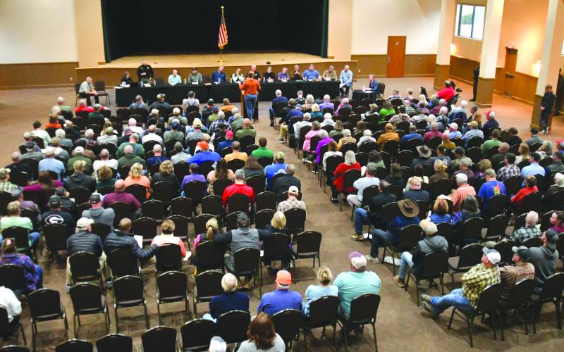Enoch Autry/The Clayton Tribune. The seats inside the Rabun County Civic Center were filled on Tuesday for a county town hall meeting about building codes and citations. Along the walls of the room, more people stood to listen at the event.