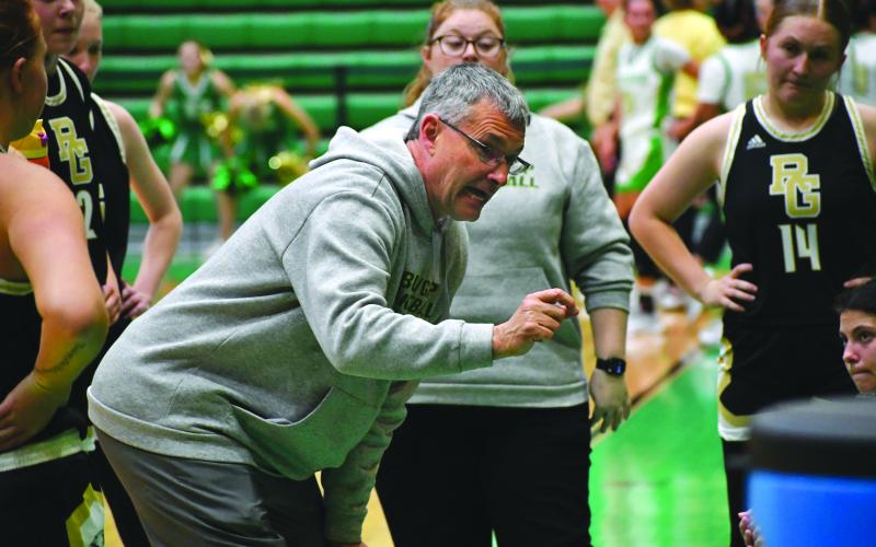 Wesley Branch/The Clayton Tribune. Rabun Gap head girls basketball coach Dale Earnhardt directs his team during a timeout in its Jan. 30 game against Buford. Earnhardt recently notched his 450th career victory as a head basketball coach.