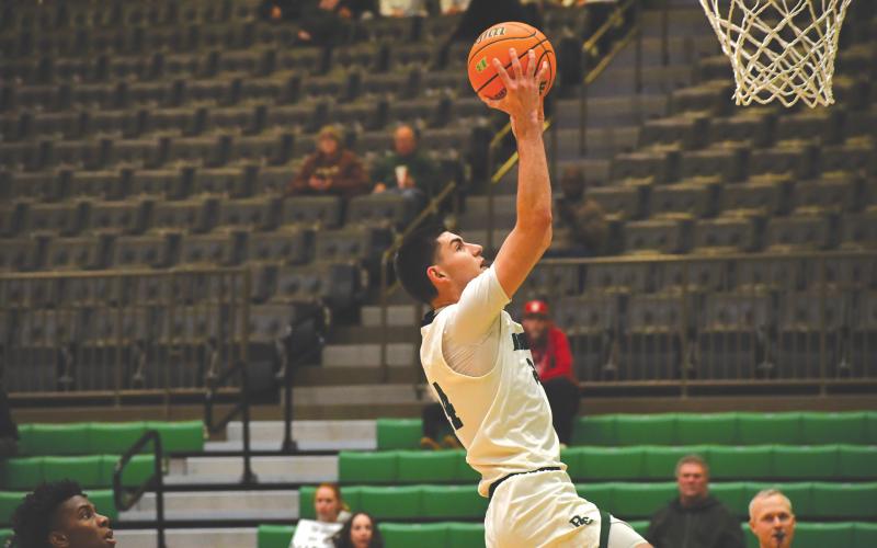 Wesley Branch/The Clayton Tribune. Rabun Gap senior Borjan Kitanovski soars for a layup in Rabun Gap’s 61-56 win over Buford on Jan. 30. Kitanovski also made a go-ahead 3-pointer with 52 seconds remaining in the win.