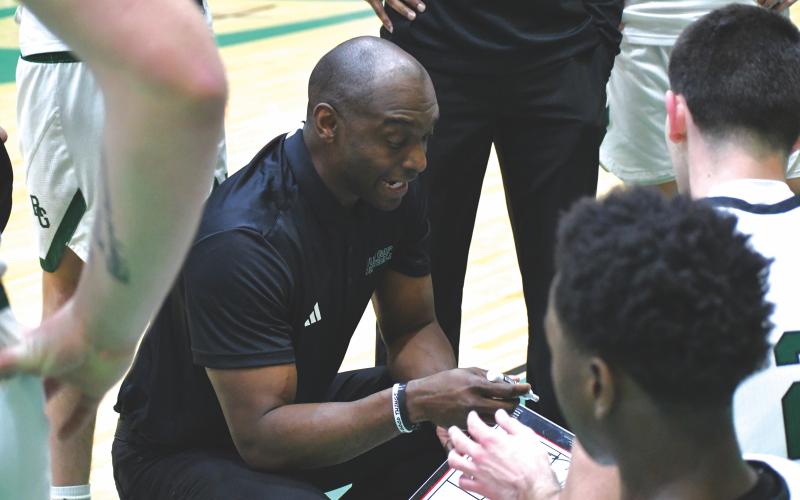 Wesley Branch/The Clayton Tribune. Rabun Gap head boys basketball coach Devin Liferidge addresses his team in Rabun Gap’s 61-56 win over Buford on Jan. 30. Liferidge is in his first season leading the Eagles, who sit at 15-8 with four games left before the playoffs.