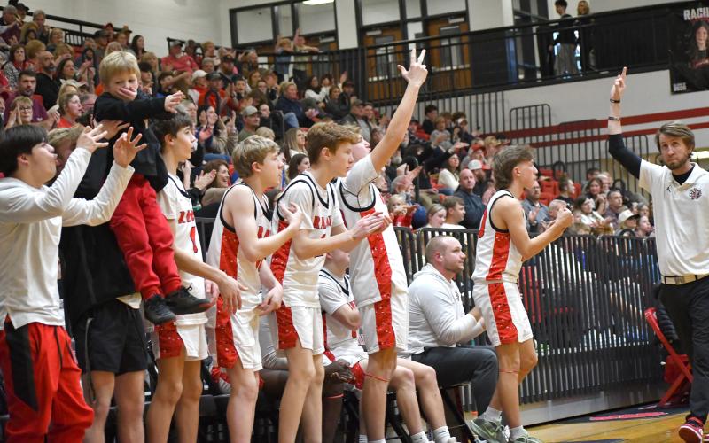 Wesley Branch/The Clayton Tribune. The Rabun County bench celebrates a 3-pointer in the Wildcats’ 62-50 win over Commerce on Feb. 12. Rabun County earned the No. 1 seed in the region with the win, setting up a matchup with Providence Christian Academy in the semifinals of the region tournament.