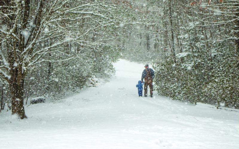 Photo courtesy of Lisa Broz.  Winter Storm Gianna offered a great opportunity for a grandfather to walk with his granddaughter.