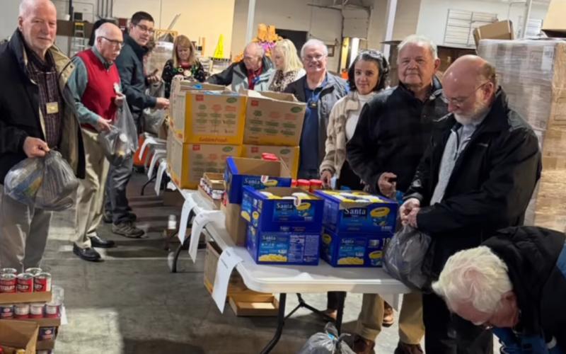 Photo courtesy of the Rotary Club of Clayton. Rotarians pack lunches for those in need at the Food Bank of Northeast Georgia. The service project is ongoing and part of many projects to benefit the Rabun County community. Service has been the focus of the organization, with Rotary members and Impact Club participants volunteering.