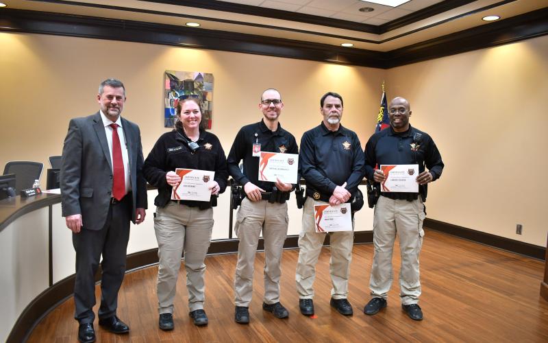 Megan Horn/The Clayton Tribune. Rabun County Schools Superintendent Steven Cole commended Rabun County Sheriff’s Office School Resource Officers (SROs) for their commitment to keeping students safe and building relationships during the Feb. 23 BOE meeting. SRO Mike Free was also named the “SRO of the Year.” Pictured are Cole, left; RCPS SRO Lisa Adams; RCMS SRO Michael Rodriguez; Free; and RCHS SRO Lindsey Owens. Not pictured is RCES SRO Ana Contreras.
