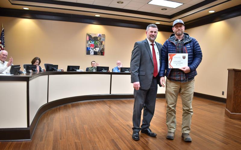 Megan Horn/The Clayton Tribune.  Rabun County Road Director Scott Provance shakes hands with Rabun County Schools Superintendent Steven Cole on Feb. 23 at the BOE meeting and accepts a certificate thanking the local Road Department for exception support during the recent winter storms.