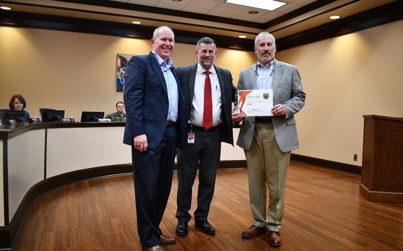 Megan Horn/The Clayton Tribune.  Rabun County Superintendent Steven Cole recognizes Habersham EMC for exceptional support on Feb. 23. Pictured are Tommy Thurman, Habersham EMC vice president of member and community relations, Cole and Bryan Ferguson, president and CEO of Habersham EMC.