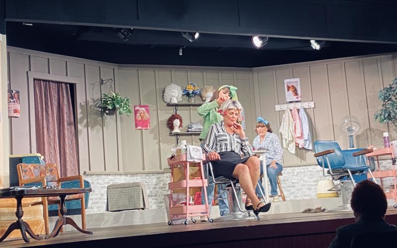 Submitted photo. Sara Jones, Elizabeth Truax and Joy Ruhe clipping, curling and gossiping in North Georgia Community Players production of Steel Magnolias.