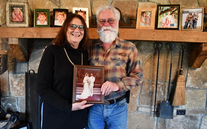 Megan Horn/The Clayton Tribune. Joe and Angela Luke have been married for 46 years and say they are “best friends.” Respecting one another is a key to their successful marriage along with their strong faith. They are pictured holding a photo from their wedding day on May 19, 1979, in Pompano Beach, Fla.