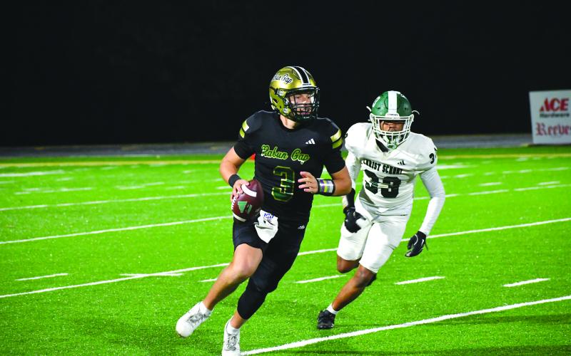 Enoch Autry/The Clayton Tribune. Rabun Gap’s quarterback Grayson Clary looks down field against Christ School during their NCISAA Nov. 7, 2025, playoff matchup.