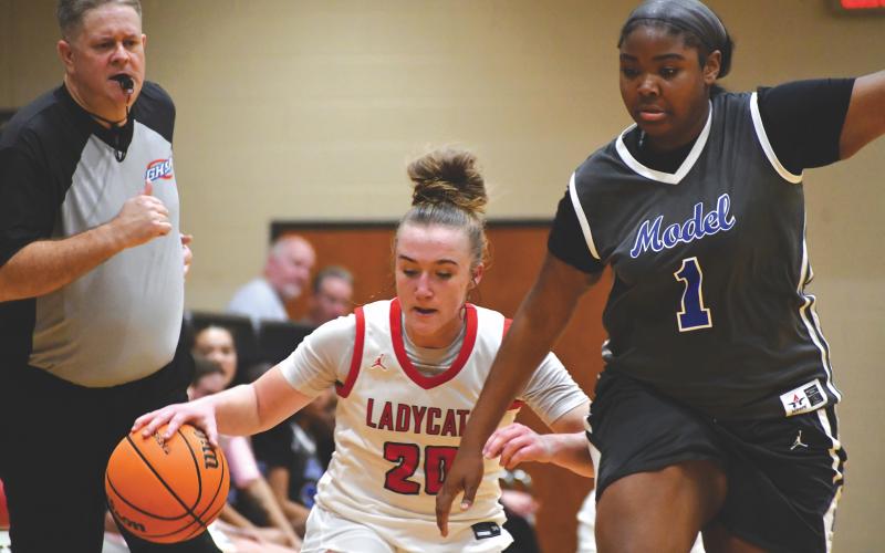 Wesley Branch/The Clayton Tribune. Rabun County freshman Millie Southards fights off pressure from Model’s Kamri Sanders in Rabun County’s 56-43 Sweet 16 win over Model on Feb. 27. Southards posted eight points, seven rebounds, six assists and two steals in the win.