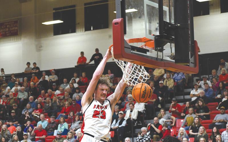 Wesley Branch/The Clayton Tribune. Rabun County senior Hayes Free throws down a powerful dunk in the Wildcats’ 84-52 win over Heard County Feb. 28 in the GHSA state playoffs. Free and the Wildcats have set a school season record with 27 wins.