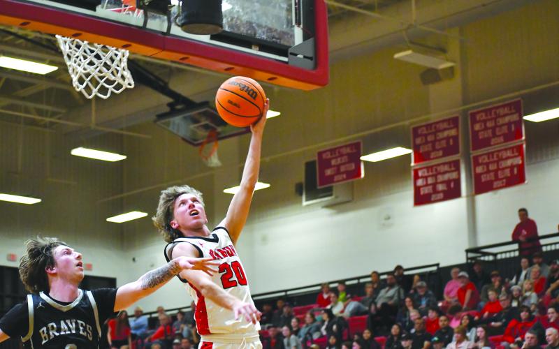 Wesley Branch/The Clayton Tribune. Rabun County senior Colton Crane rises for a layup in Rabun County’s 84-52 win over Heard County on Feb. 28 in the Sweet 16. Crane is one of three seniors on the boys basketball team.
