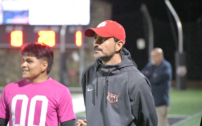 Wesley Branch/The Clayton Tribune. Rabun County head boys soccer coach Cameron Heyen watches his team from the sideline in its 7-3 March 6 win at home over Elbert County. The victory marked Heyen’s first win as the boys head coach.