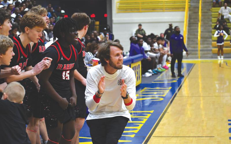 Wesley Branch/The Clayton Tribune. Rabun County head coach David Adcock implores his team from the sideline in the Wildcats’ 70-59 win over Fitzgerald in the Final Four March 7. The Wildcats now face Southwest March 13 for the state title.