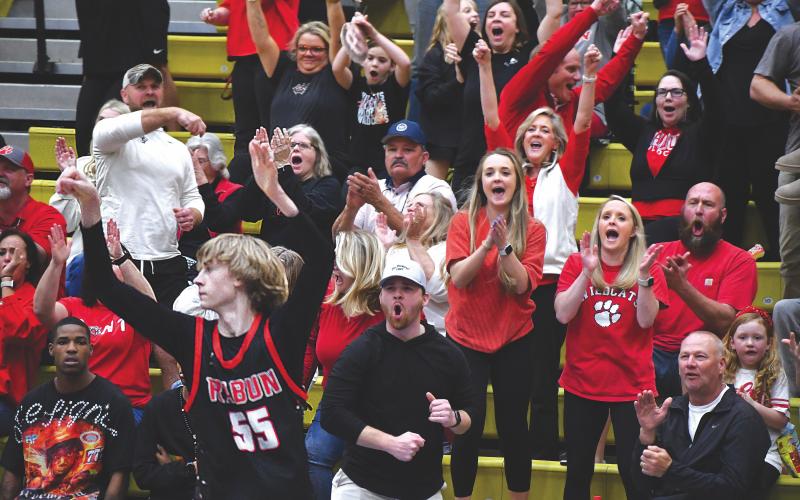 Wesley Branch/The Clayton Tribune. The Rabun County crowd celebrates after a made 3-pointer by Wildcat freshman Trace Adcock late in the fourth quarter of their 70-59 win over Fitzgerald in the Final Four on March 7 at Fort Valley State University. Adcock ranks No. 21 in the country in made 3-pointers this season according to MaxPreps.